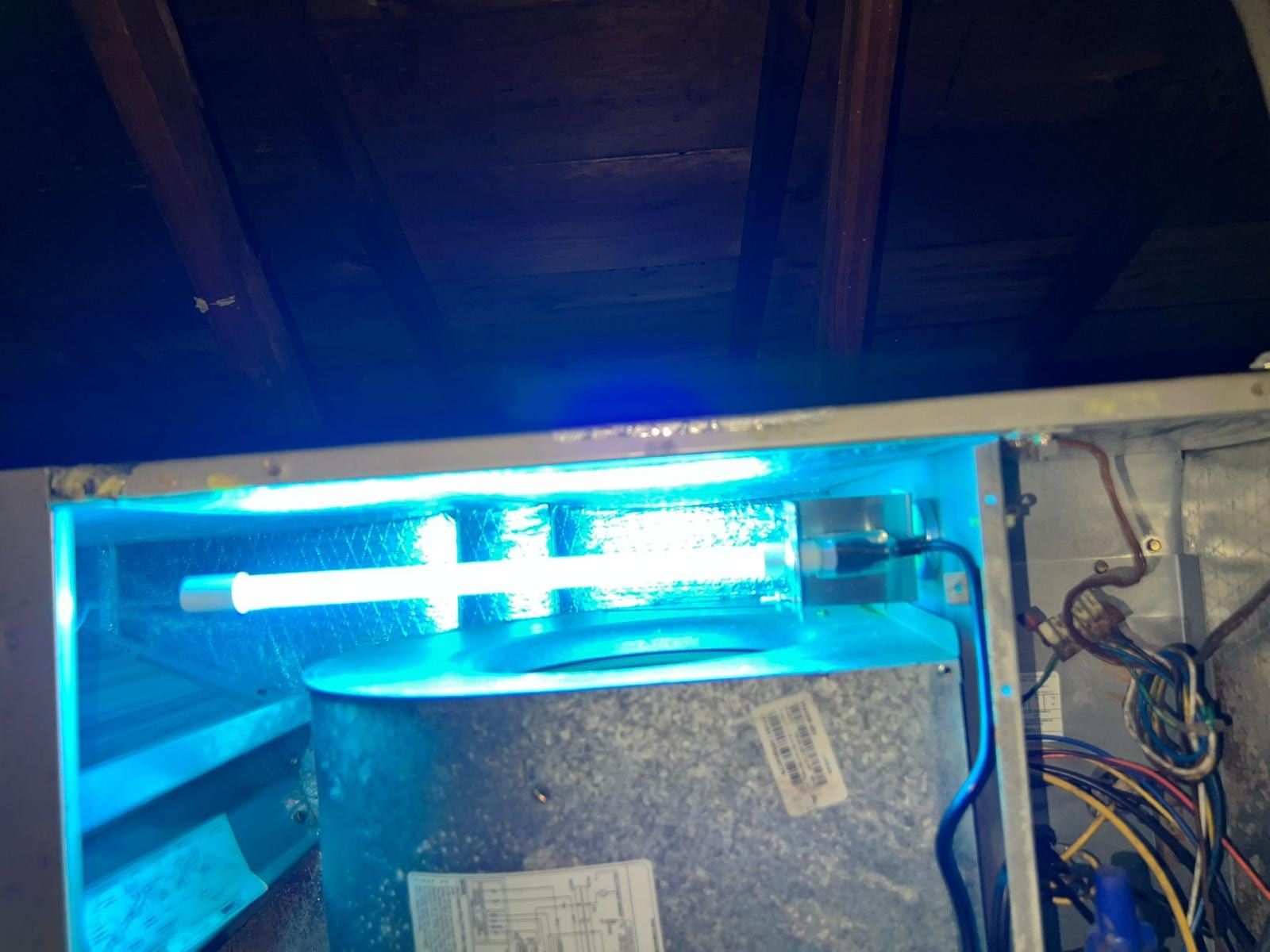 A UV lamp fitted inside a cleaned air handler cabinet